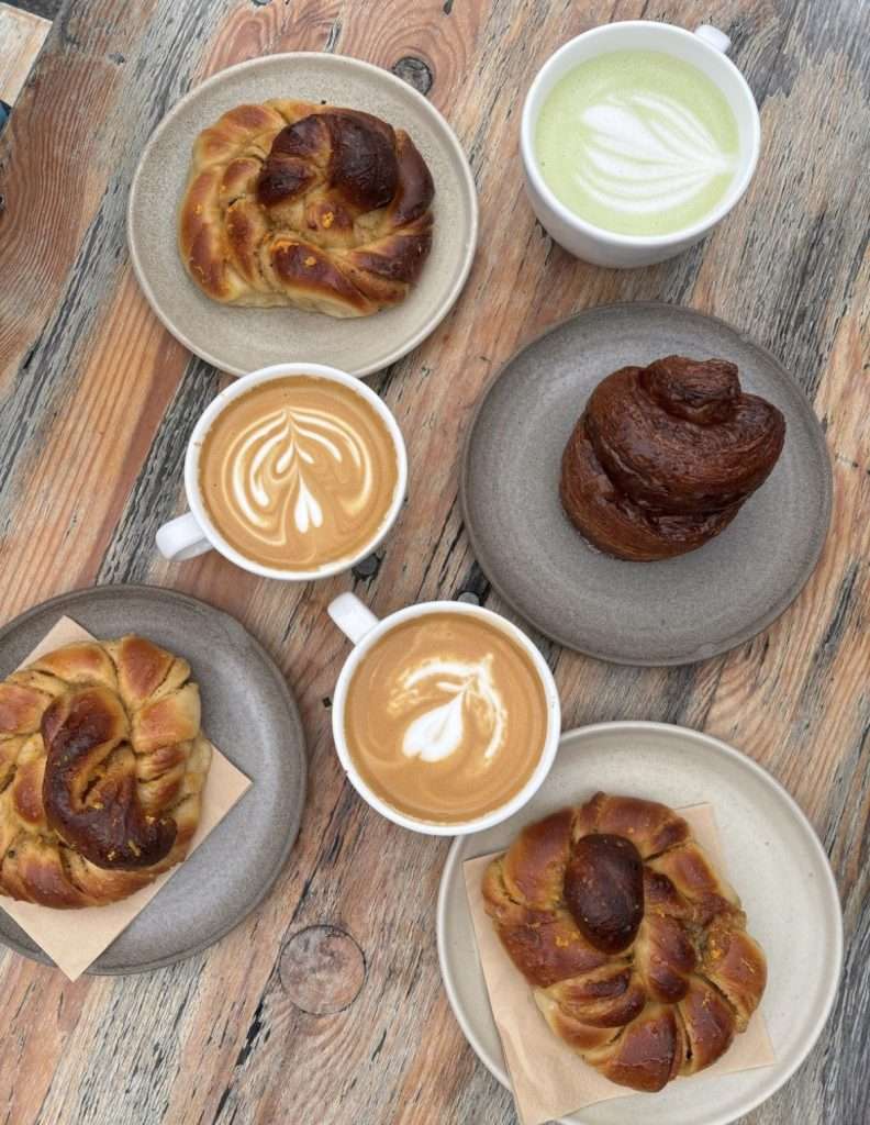 Traditional Danish cinnamon pastries with coffee on a cosy autumn morning in copenhagen