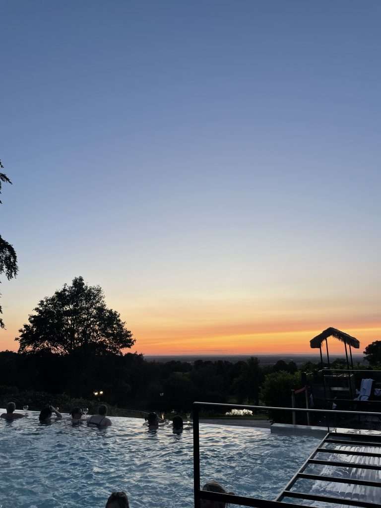 a view of the pool at the spa, with a gorgeous sunset
