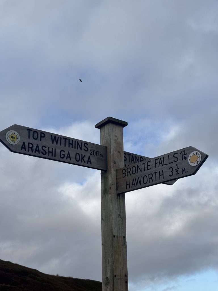 sign post for the walk to top withins and bronte falls in Haworth