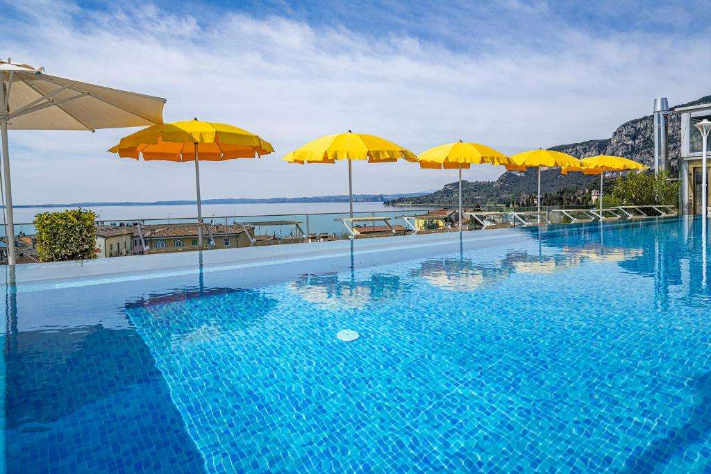 Pool and mountain view of Sky pool hotel in garda lake garda
