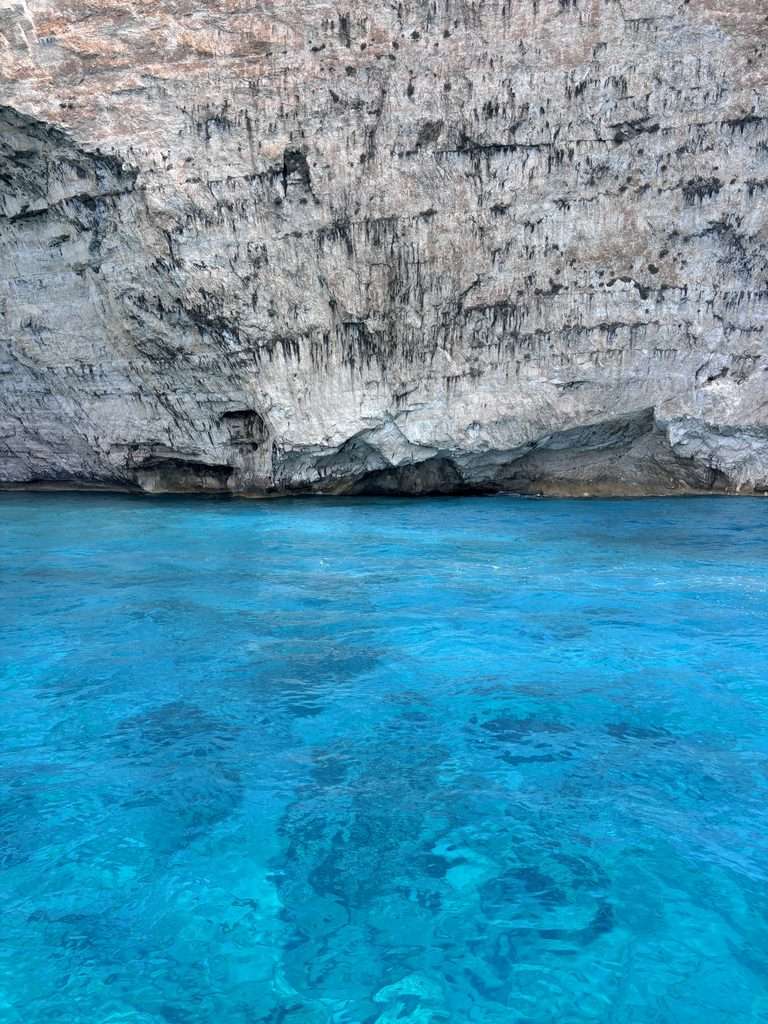 Blue water and rocky sea caves on a boat tour in Zante