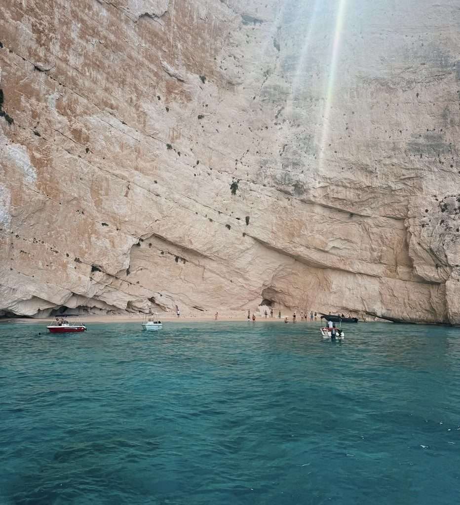 approaching the white beach in zante by boat, view of the beach and cliffs