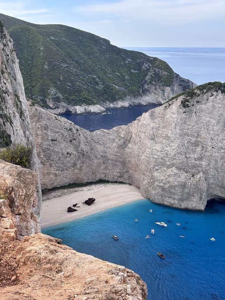 View of Shipwreck Beach in Zante with turquoise water, white cliffs and the shipwreck, seen during a Zante shipwreck boat tour.