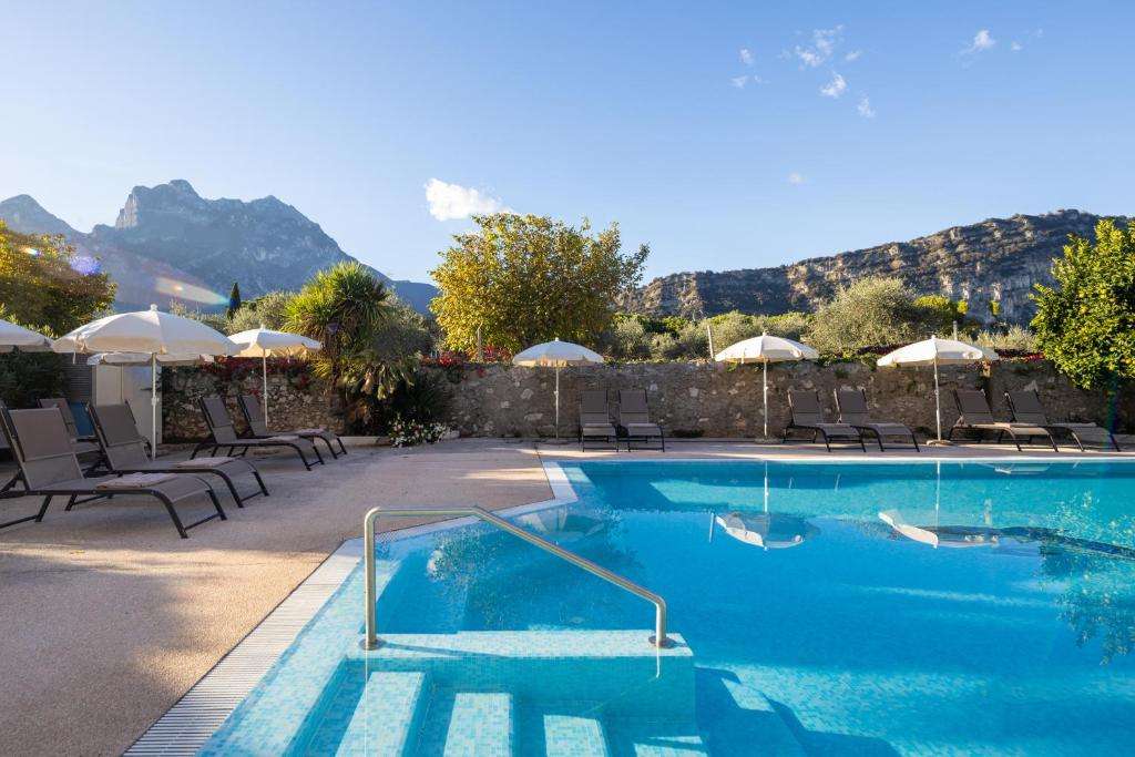 pool view in Villa Claudia in Torbole, northern Lake Garda, Italy.